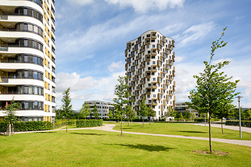 Residential area in the city, modern sustainable high-rise apartment buildings in a green environment