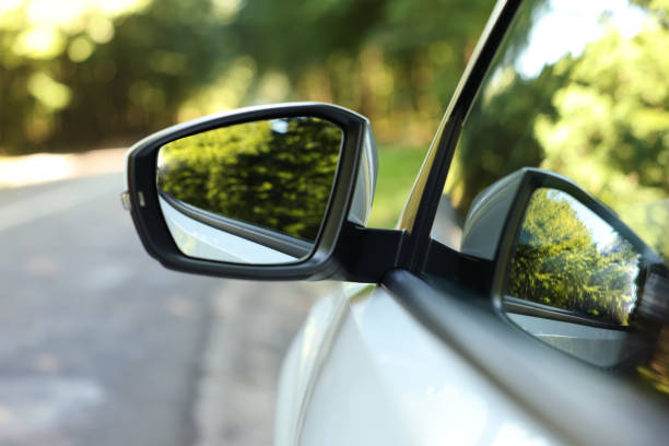 istock Side view mirror of modern car on blurred background, closeup 1932519209