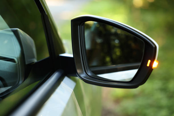 istock Side view mirror of modern car on blurred background, closeup 1932519759