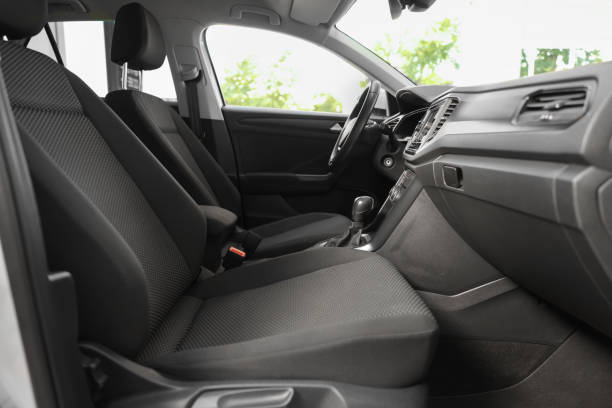 istock Stylish car interior with steering wheel and comfortable seats inside 1932520872