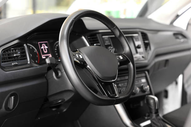 istock View of steering wheel and dashboard inside of modern car 1932521379