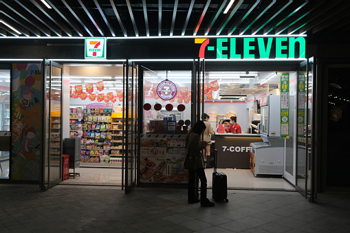 Shanghai,China-May 12th 2023: 7-Eleven convenience store with customers at night