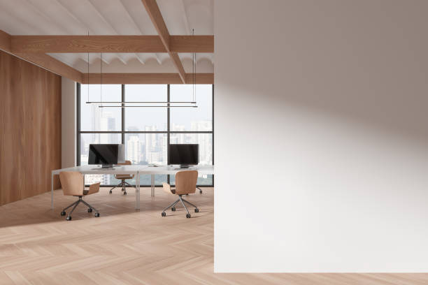 istock Office coworking interior with chairs, pc computers and desk. Mock up wall 1932532454