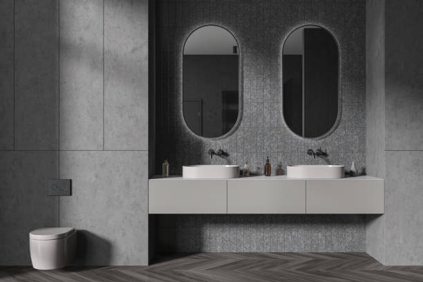 istock Gray bathroom interior with double sink and toilet 1932541033
