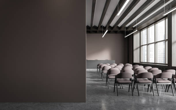 istock Brown lecture hall interior with chairs and blank wall 1932542154