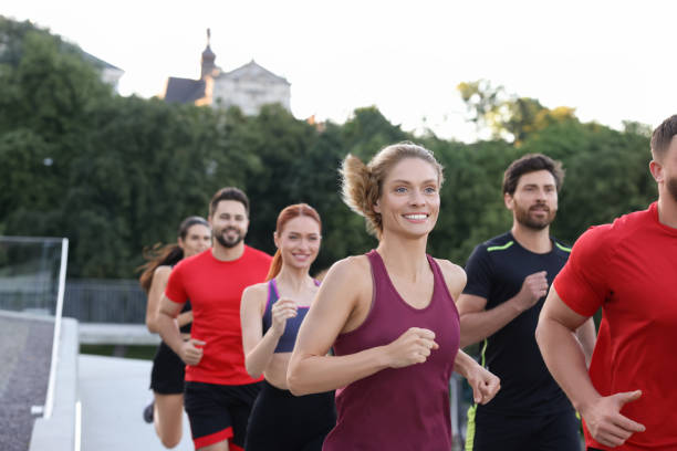 istock Group of people running outdoors. Active lifestyle 1932548170