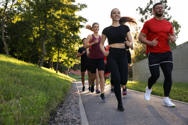 istock Group of people running outdoors. Active lifestyle 1932548178