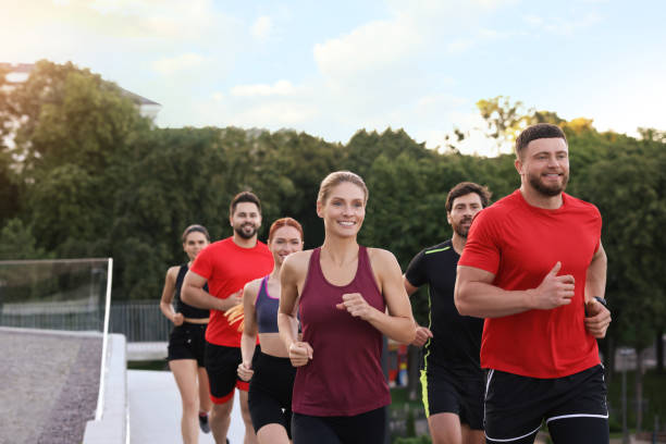istock Group of people running outdoors. Active lifestyle 1932548198