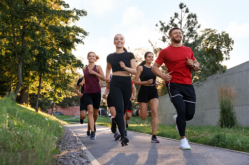 Group of people running outdoors. Active lifestyle