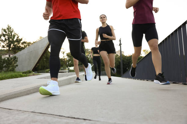 istock Group of people running outdoors. Active lifestyle 1932549831