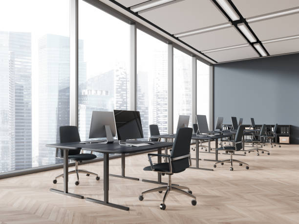 istock Stylish office coworking interior with pc desktop, drawer and panoramic window 1932557853