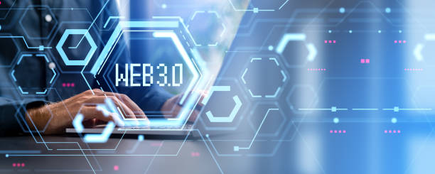 istock Businessman using laptop, glowing web 3.0 internet hologram 1932564325