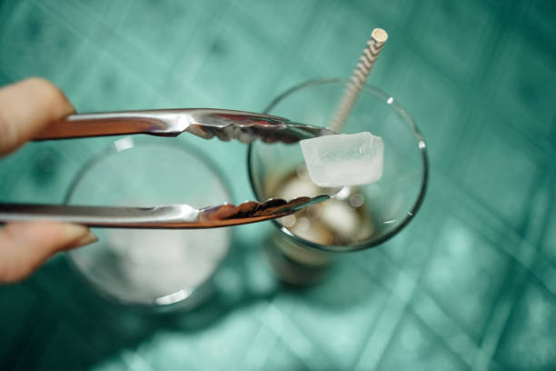 Preparing drink with ice