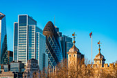 Skyline of City of London with corporate office buildings of at sunset