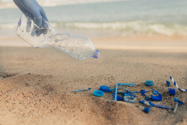 istock Plastic bottles and other trash on sea beach 1932597929