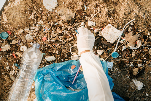 Plastic bottles and other trash on sea beach