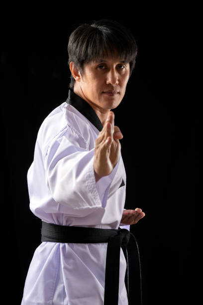 istock Taekwondo Training One Asian Man Poses on black background 1932600598