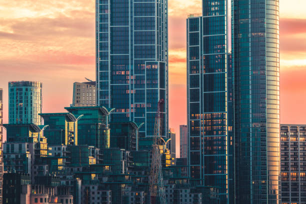 view of the st george wharf area illuminated by a beautiful sunset - london england apartment uk real estate fotografías e imágenes de stock