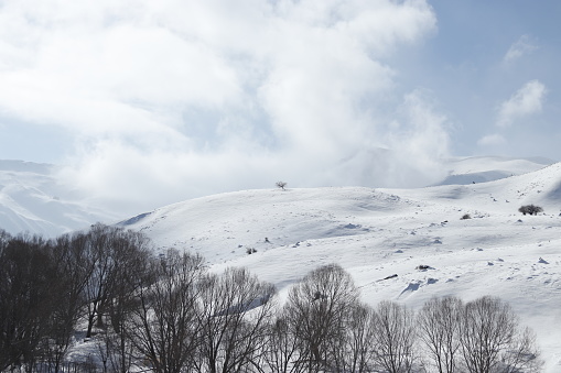 Snowcapped mountains. Ski resort.