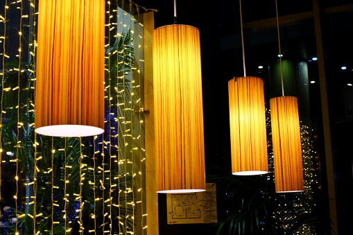 Designer lamps with warm light in a cozy cafe