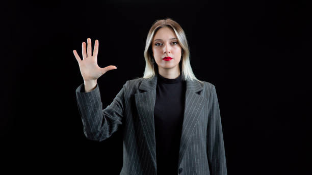istock Nice young woman using transparent screen, Biometric verification or face recognition concept, Graphical User Interface. 1932625433