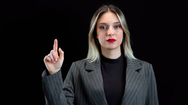 istock Nice young woman using transparent screen, Smart serious woman focusing on work. 1932625958