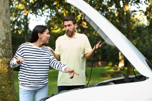 istock Stressed couple near broken car outdoors on summer day 1932631228