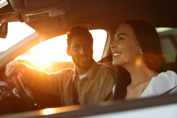 istock Happy couple enjoying trip together by car, selective focus 1932636003