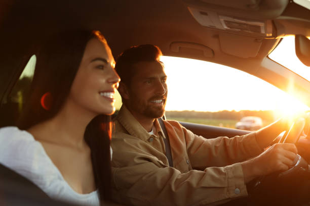 istock Happy couple enjoying trip together by car, selective focus 1932638790