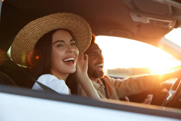 istock Happy couple enjoying trip together by car, selective focus 1932639067