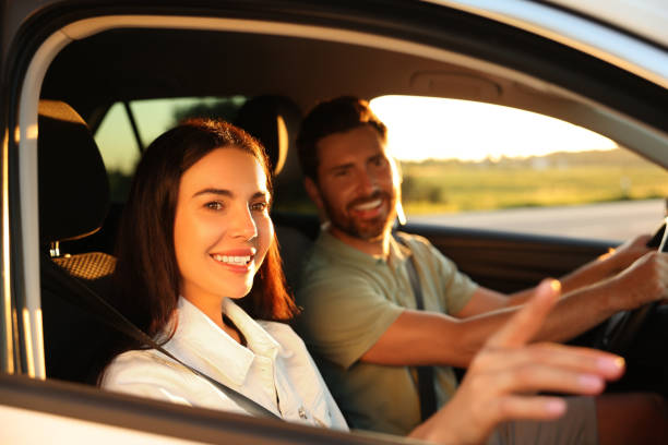 istock Happy couple enjoying trip together by car, selective focus 1932639224