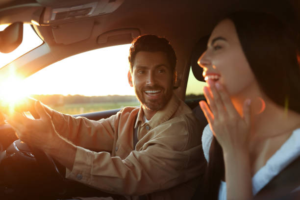 istock Happy couple enjoying trip together by car, selective focus 1932639733