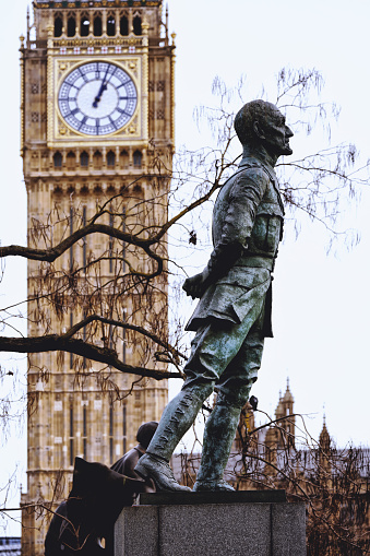 Central London, England United Kingdom UK – December 26th, 2023: The UK Parliament – The capital city of England, The United Kingdom, street photography at daytime.\n\nRequested information about the The statue of Mr. Jan Christian Smuts:\nA life-size bronze statue of Jan Smuts was designed and made by the British artist Jacob Epstein stands on the north side of Parliament Square in London, United Kingdom, it is still located between a statue of Lord Palmerston and a statue of David Lloyd George. The statue was made and opened in 1956.