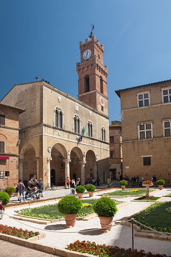 Pienza, Italy - 2022, April 30 : The Pius II square of Pienza with the town hall on the left and the episcopal palace on the right