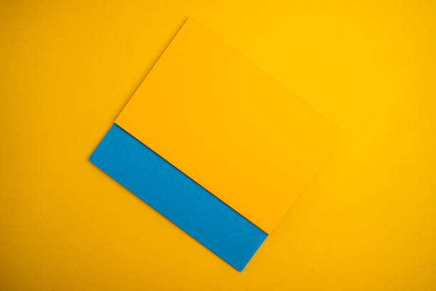 istock Paper yellow and blue envelopes on a light background. New mail, write a message. Send and receive mail. Postal delivery service. Empty envelope, empty space. Envelope close-up 1932648881