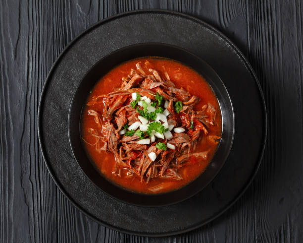 istock birria de res, mexican beef stew in pepper sauce 1932664573