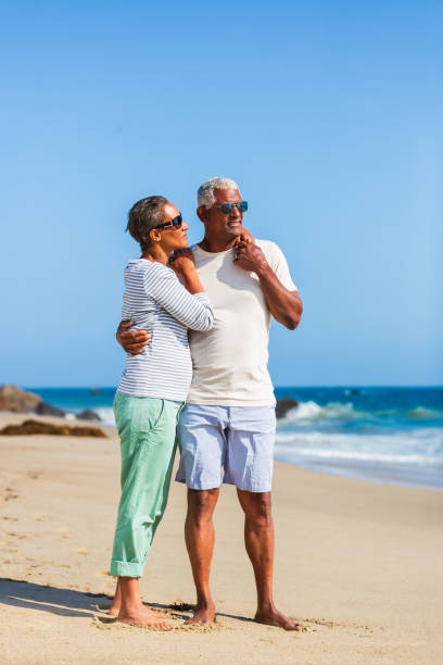 istock Senior African American couple embracing on beach 1932682187