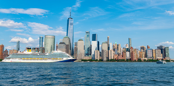 New York, USA - June 16, 2023: Cruise ship Carnival Veneziaw York. Skyline of New York Manhattan cruising on the Hudson River cruise liner Carnival cruise lines