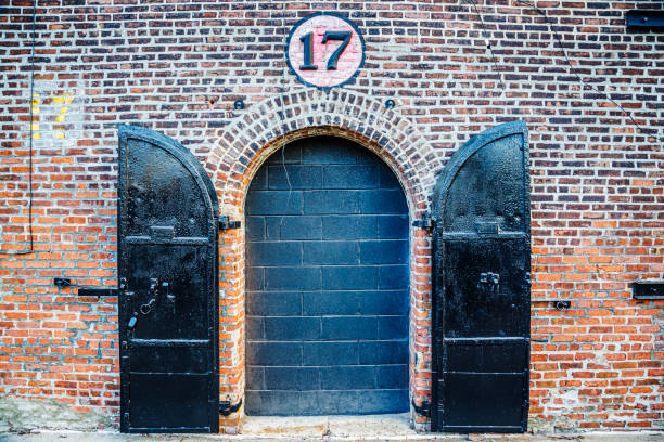 istock Metal door on brick wall with arch 1932682733
