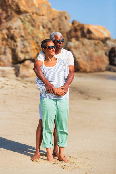 istock Senior African American couple embracing on beach 1932684437
