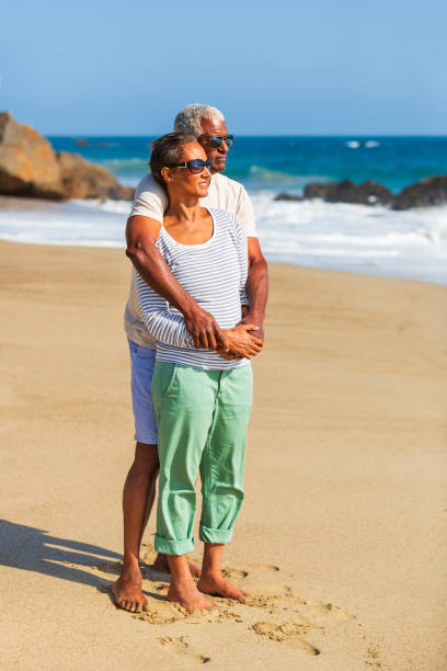 istock Senior African American couple embracing on beach 1932684939