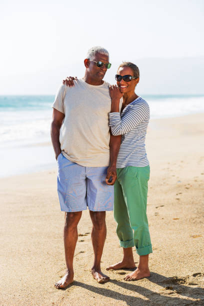 istock Senior African American couple embracing on beach 1932685979