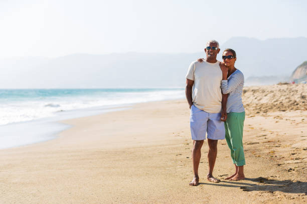 istock Senior African American couple embracing on beach 1932686529