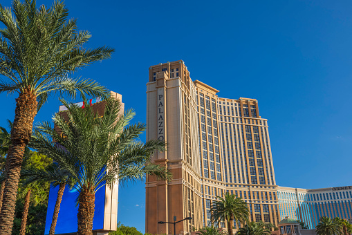 Las Vegas. USA. 09.25.2023. Beautiful view of facade skyscraper of hotel casino Palazzo against backdrop of blue sky.