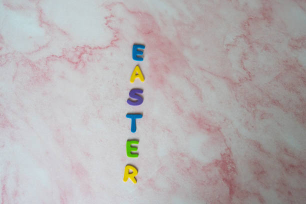 Easter in colorful letters on a pink marble background