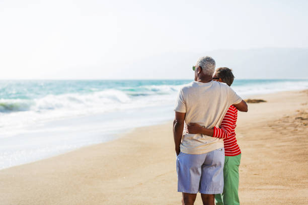 istock Senior African American couple embracing on beach 1932690831