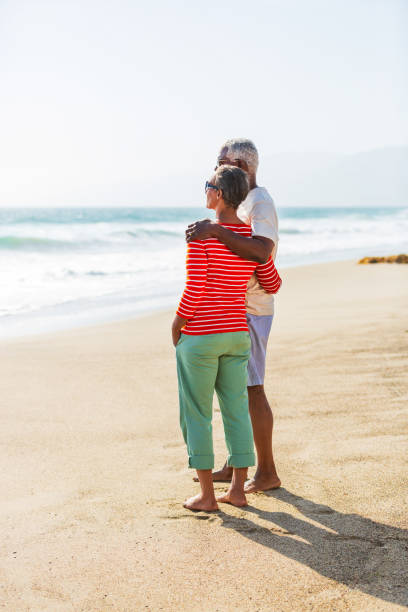 istock Senior African American couple embracing on beach 1932692407