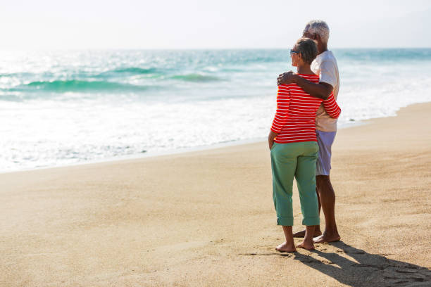 istock Senior African American couple embracing on beach 1932692444