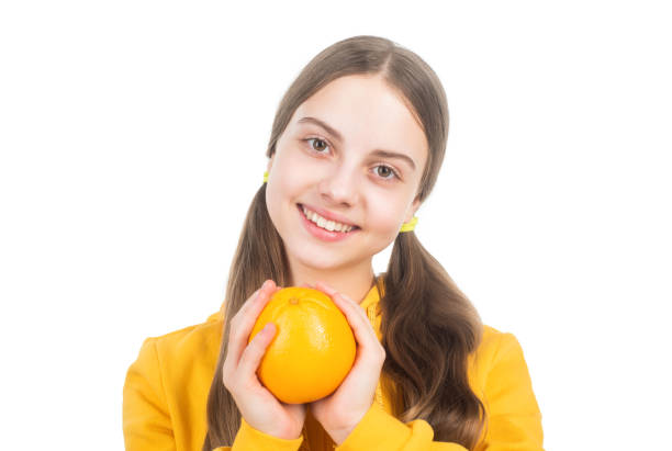 happy kid hold citrus lemon fruit with vitamins isolated on white, vitamin.
