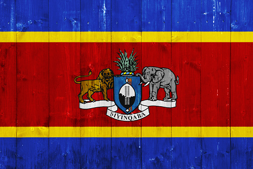 Flag and coat of arms of Kingdom of Eswatini on a textured background. Concept collage.